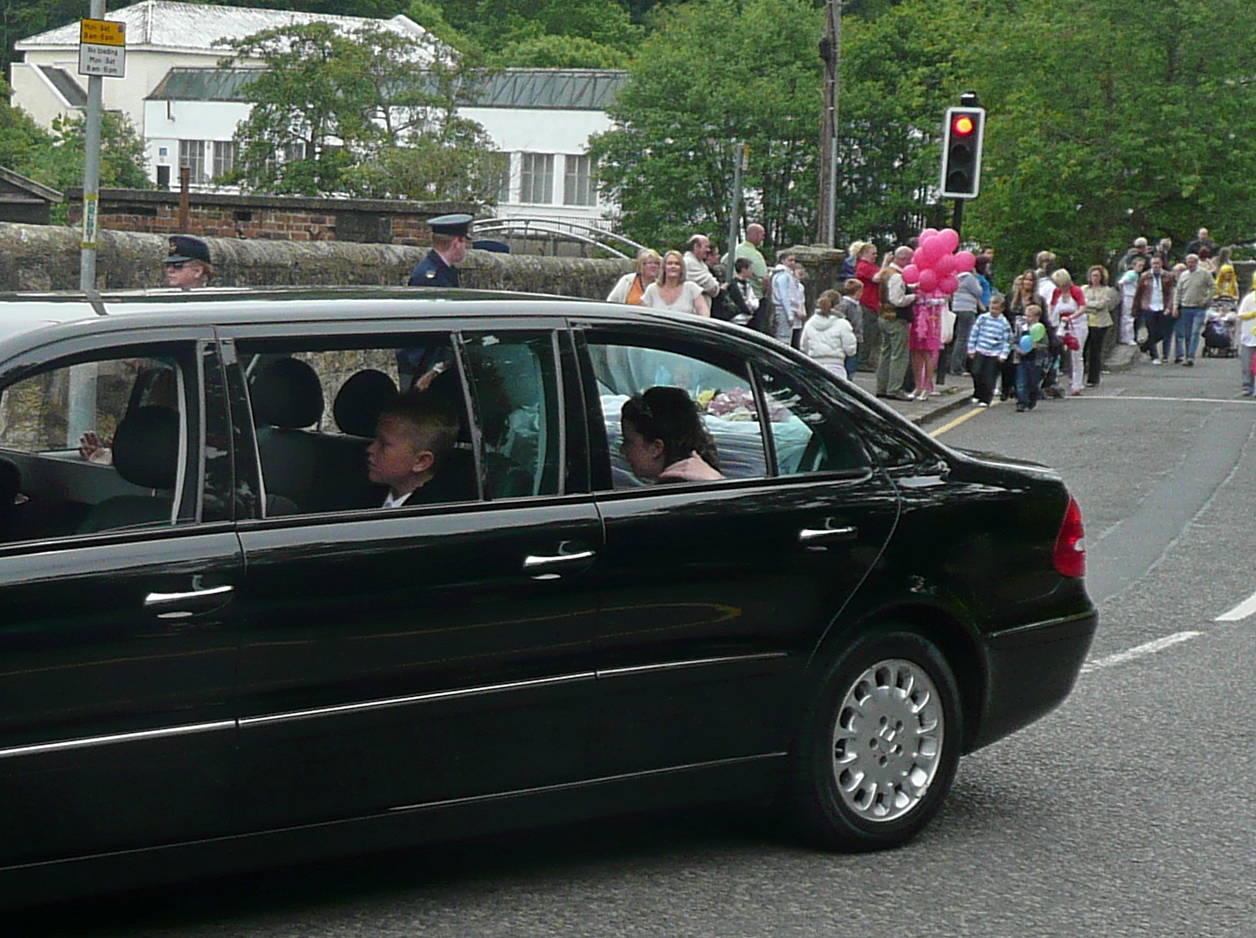 The limousine carrying the Tartan Queen and her Court