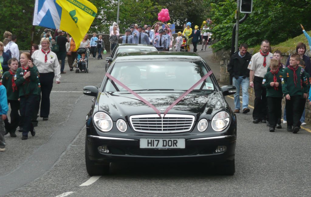 The limousine carrying the Tartan Queen and her Court