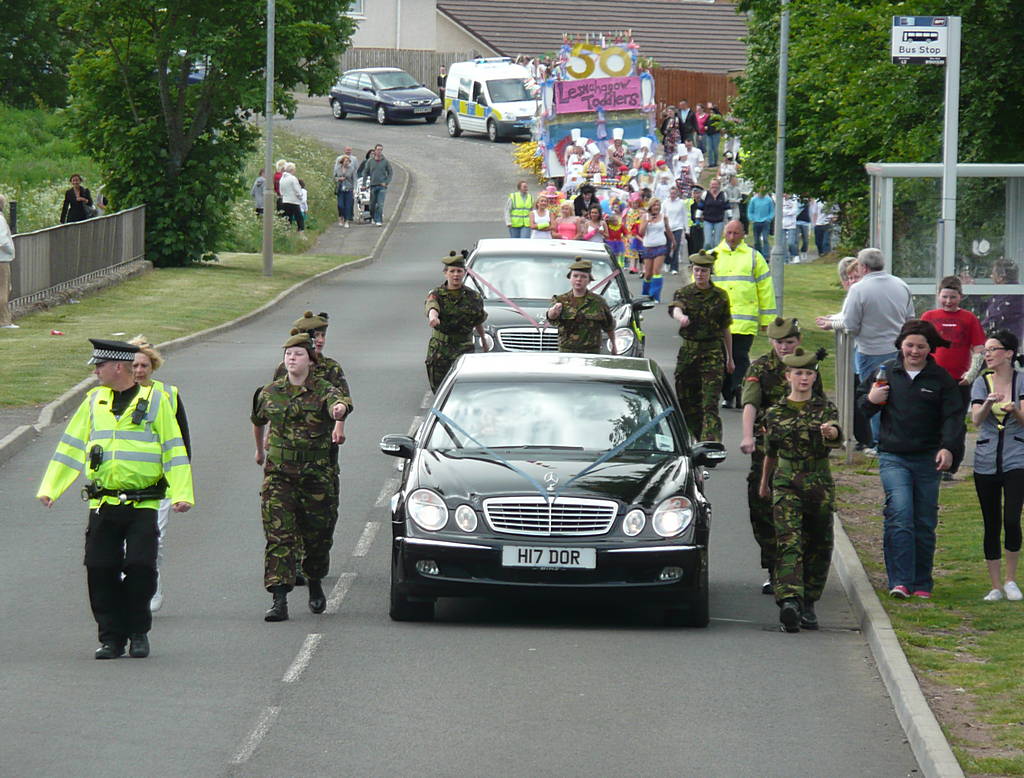 The procession led by the two Dorricott limousines carrying the Gala Queen and her court