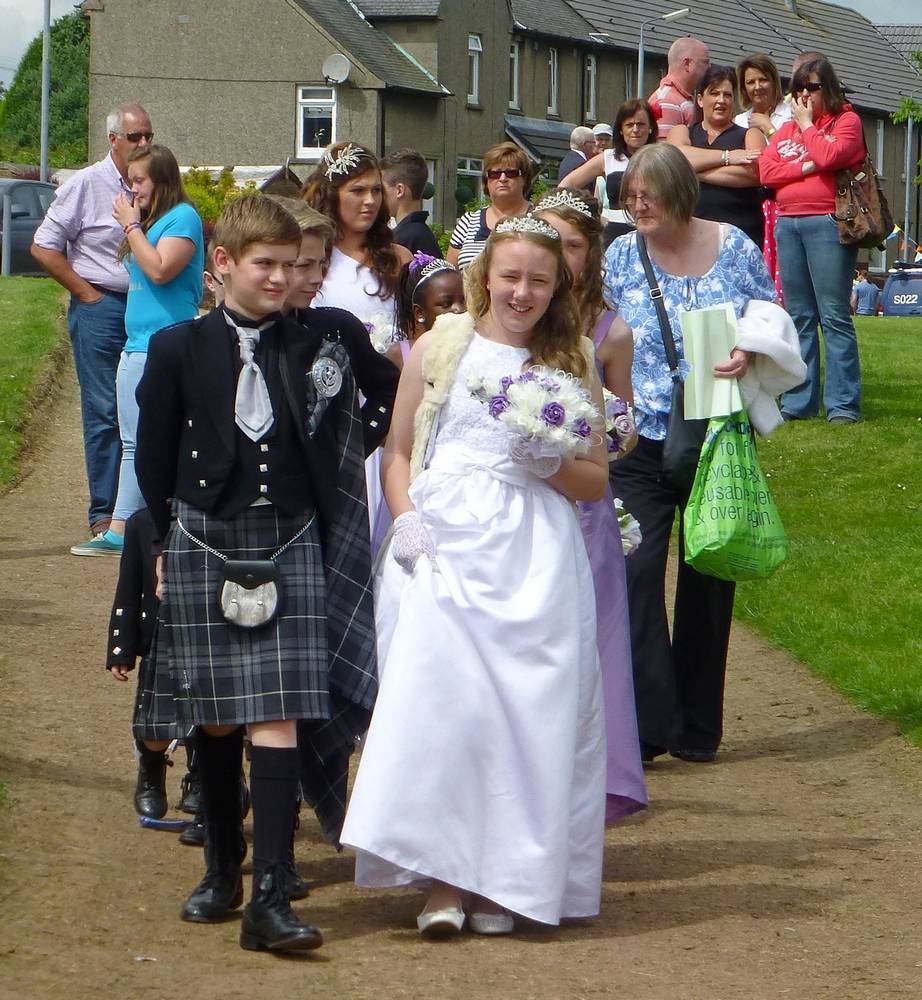 Queen Robyn and her court on the way to the Crowning