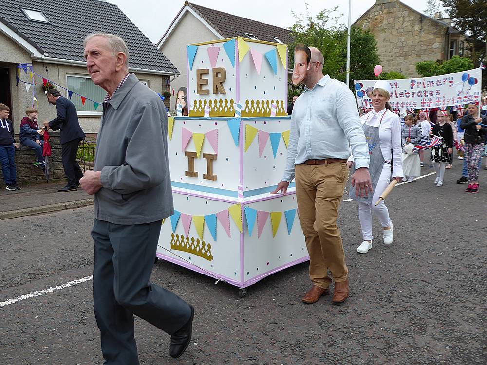 Look out, William! You are being followed by a woman with a rolling pin at the ready!