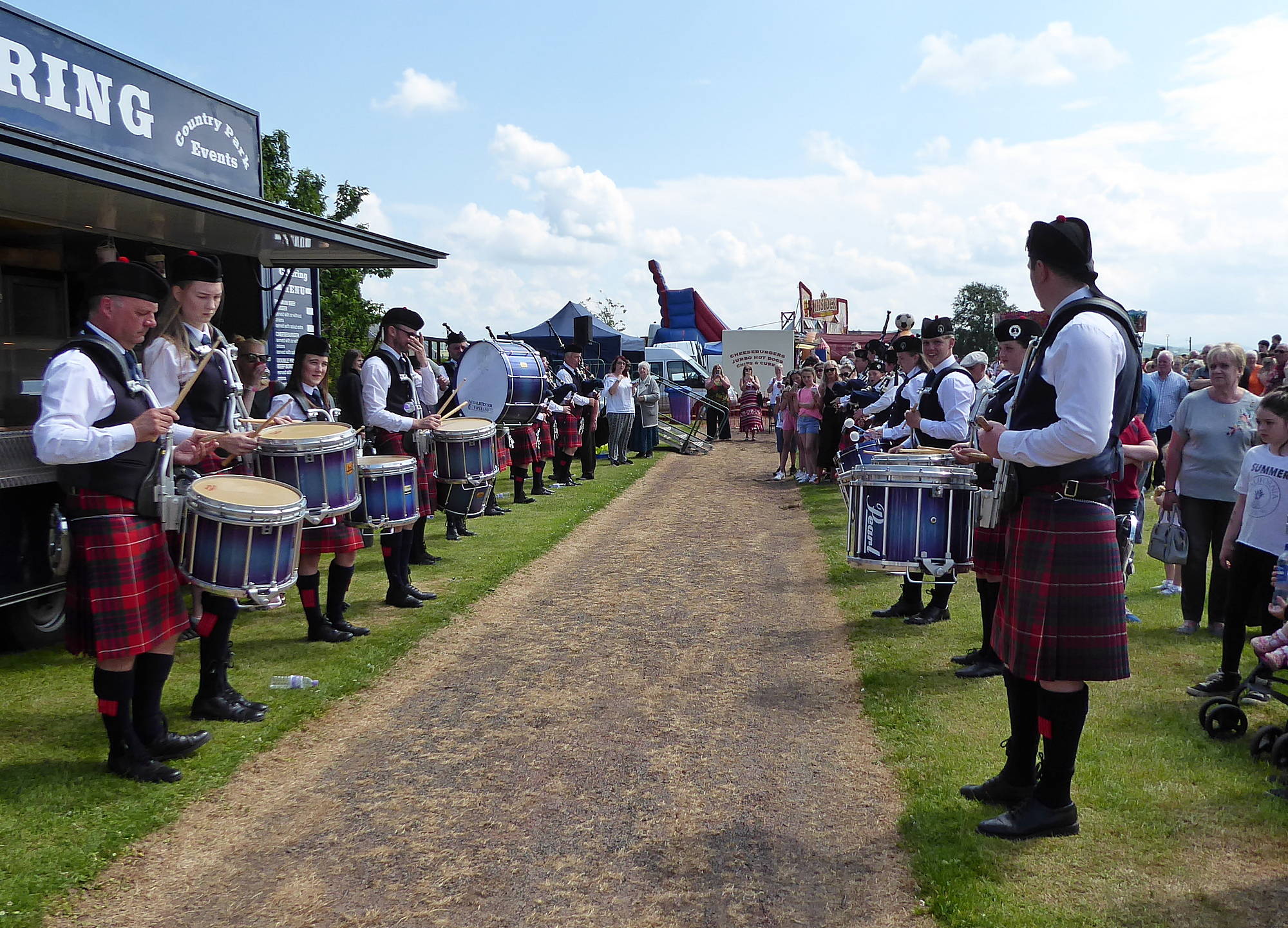 Coalburn IOR Pipe Band lining the route to the Coronation.