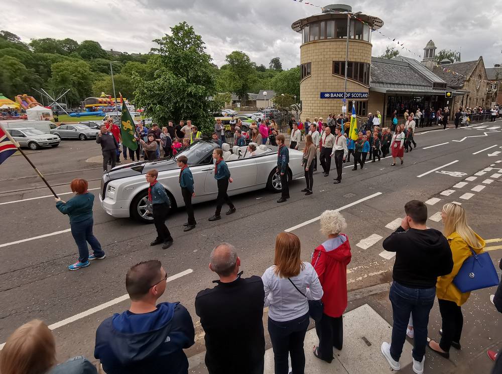 convertible carrying the Tartan Queen Eva