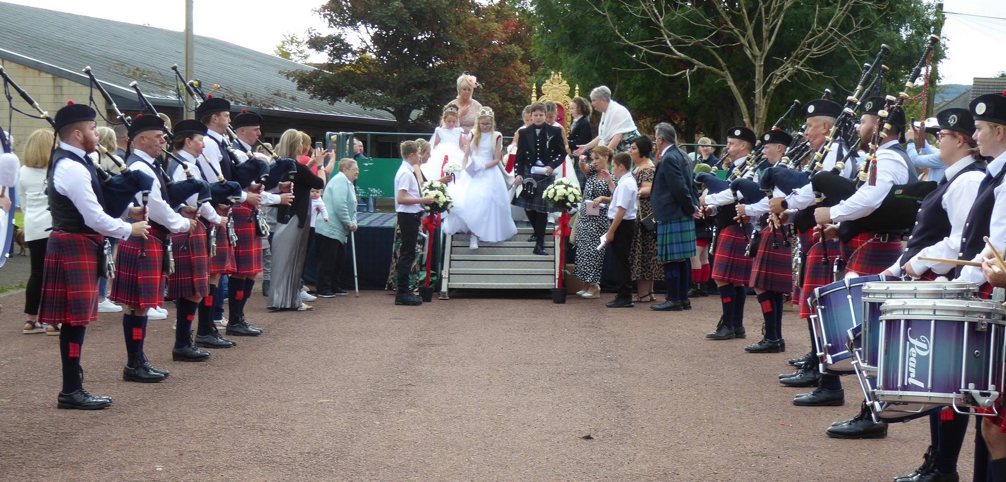 The Gala Queen and her court leaving the crowning podium