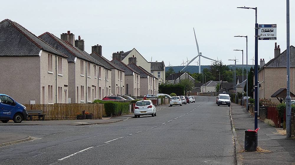 The very tall wind turbine seen from Coalburn Road near Dunn Crescent