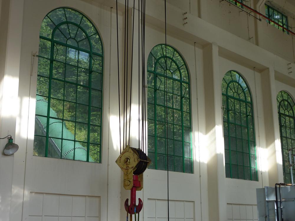 The elegant windows inside Stonebyres with a view through of the green inlet tube