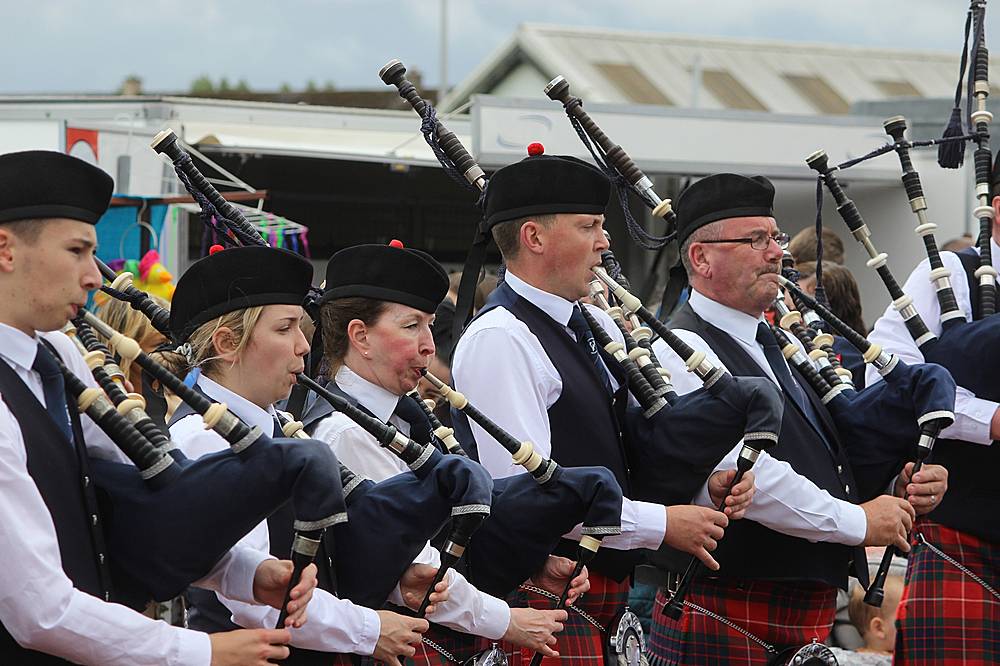 Pipers piping in the procession to the podium