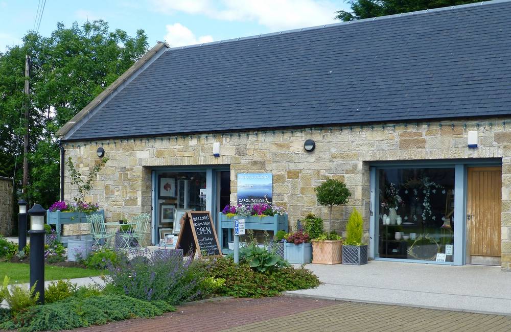 Carol Taylor's Artists' Studio next to the  Scrib Tree Coffee House on the A70 trunk road through village.