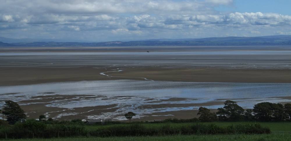 View over sands of Morecambe Bay from road between Grange-over-Sands and Barrow.